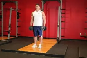 Lifting dumbbells for biceps standing