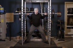 Squats in the power frame with the rod in vise