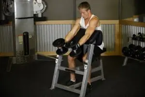 the Bending of the arms at the bicep grip &#8220;hammer&#8221; on the Scott bench