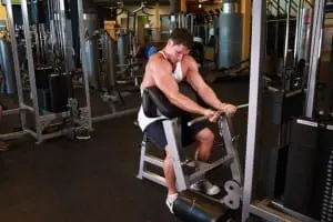 the Bending of the arms at the biceps on the Scott bench on the lower unit