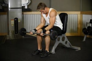 wrist Flexion with barbell sitting on the bench (palms up)