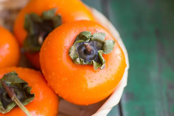 For whom persimmon may be harmful