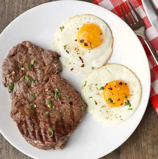 Beefsteak with egg recipe. Calorie, chemical composition and nutritional value.