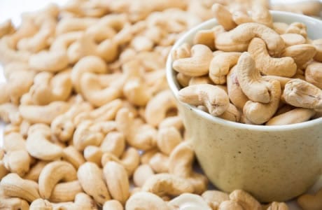 Calorie Cashew, dry roasted, with salt. Chemical composition and nutritional value.