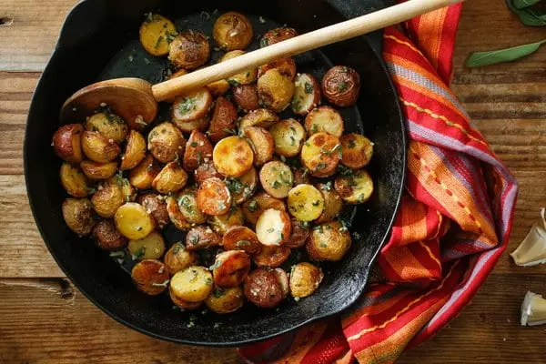 Calorie Peasant potatoes, frozen, cooked with salt, after cooking in the oven. Chemical composition and nutritional value.