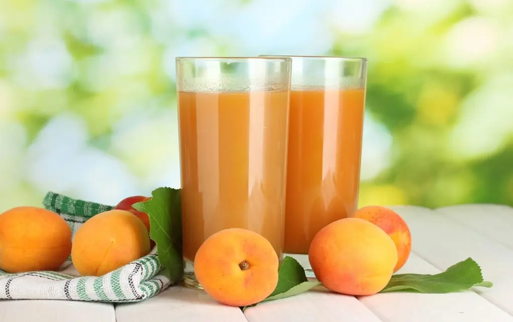 Orange and apricot juice drink, canned