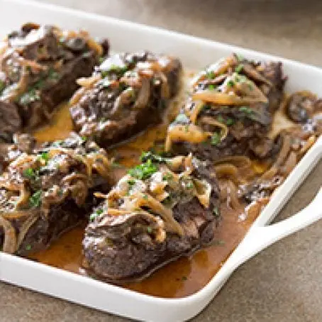 Recipe Baked beef in onion sauce. Calorie, chemical composition and nutritional value.