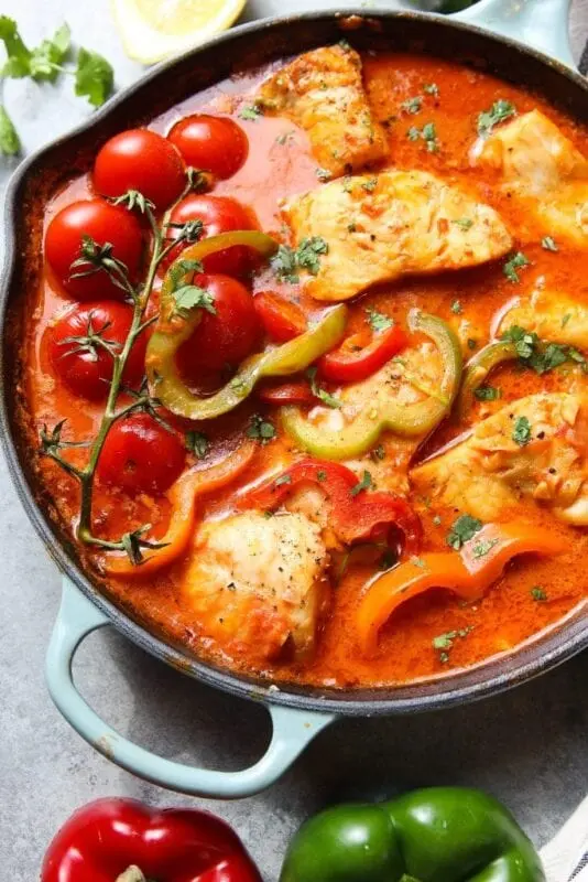 Recipe Fish, stewed in tomato and vegetables. Calorie, chemical composition and nutritional value.