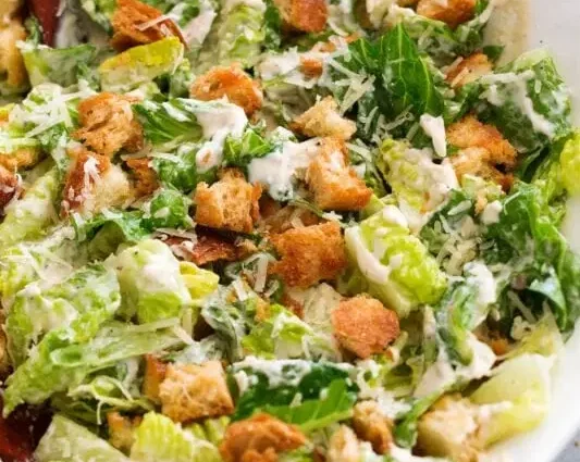 Recipe for Caesar Salad. Calorie, chemical composition and nutritional value.