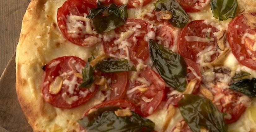 Recipe for Pizza with Tomatoes and Cheese. Calorie, chemical composition and nutritional value.