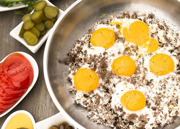 Recipe Fried eggs with meat products. Calorie, chemical composition and nutritional value.