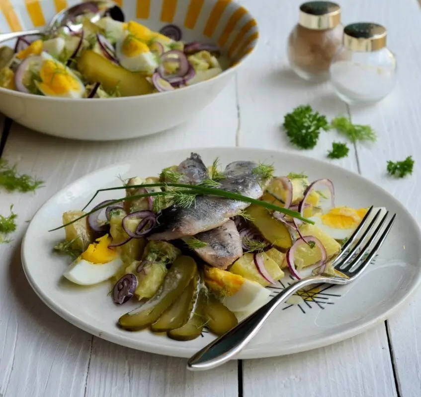 Recipe Herring with a side dish. Calorie, chemical composition and nutritional value.