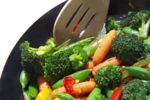 How does cooking vegetables affect the vitamin content?