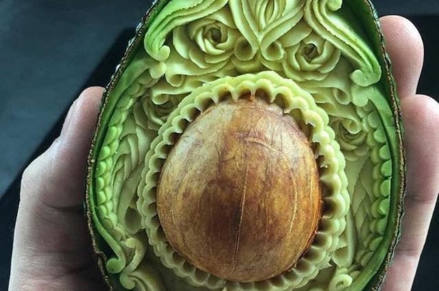 The sculptor carves masterpieces from avocado