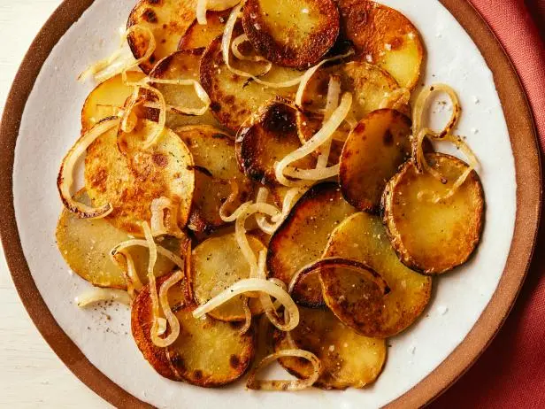 Fried potatoes with onions in vegetable oil