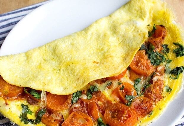 Omelet with milk and tomato