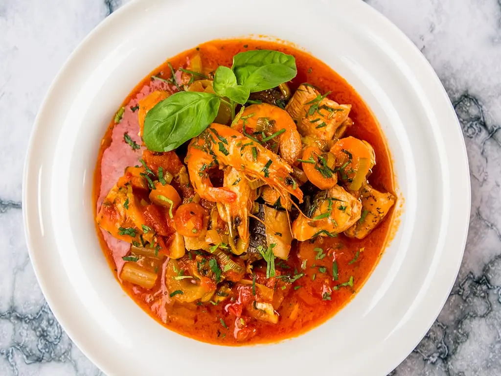 Pollock fillet with vegetables stewed