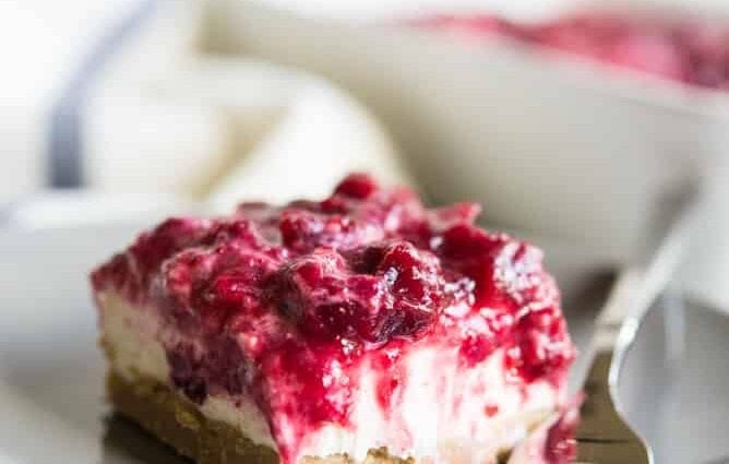 PP cheesecakes in the oven with cranberries and lingonberries