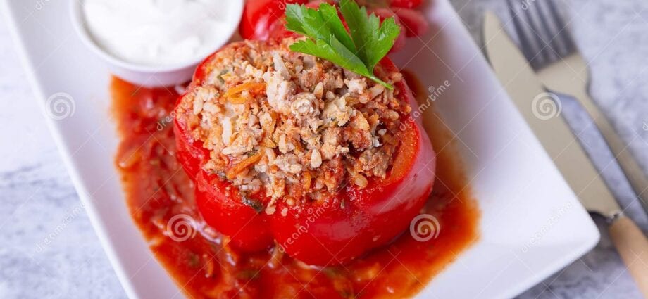 Pepper stuffed beef. with sour cream and tomatoes