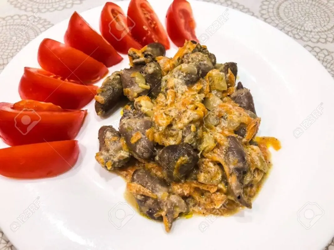 Stewed hearts with carrots and onions