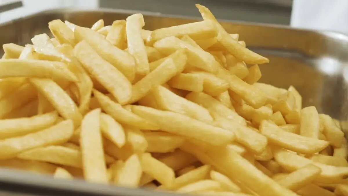 French fries in a deep fryer. Video recipe