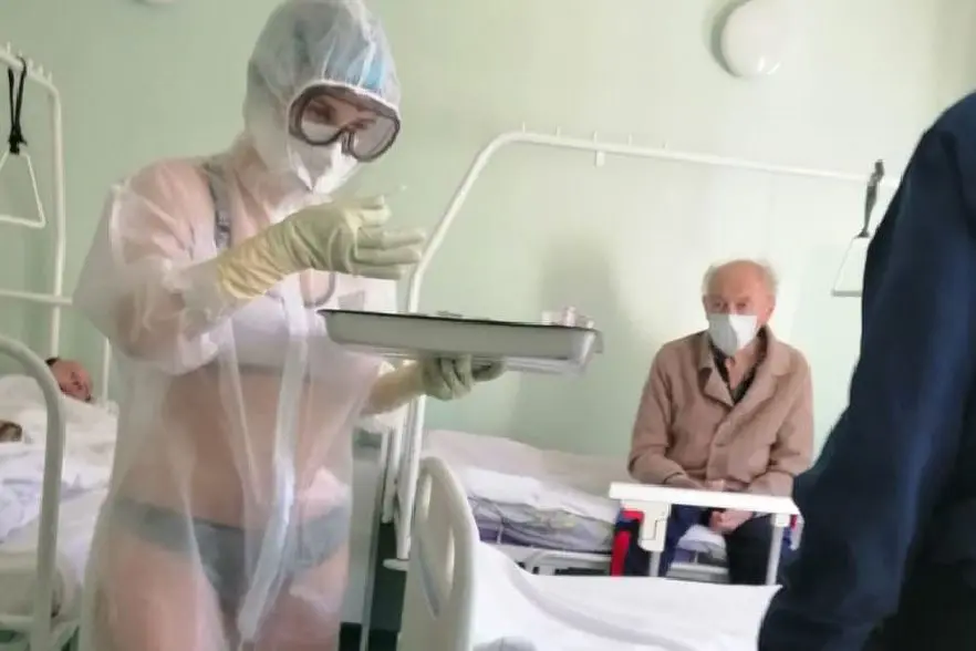 Gorgeous! What a nurse looks like when wearing a swimsuit under a protective suit