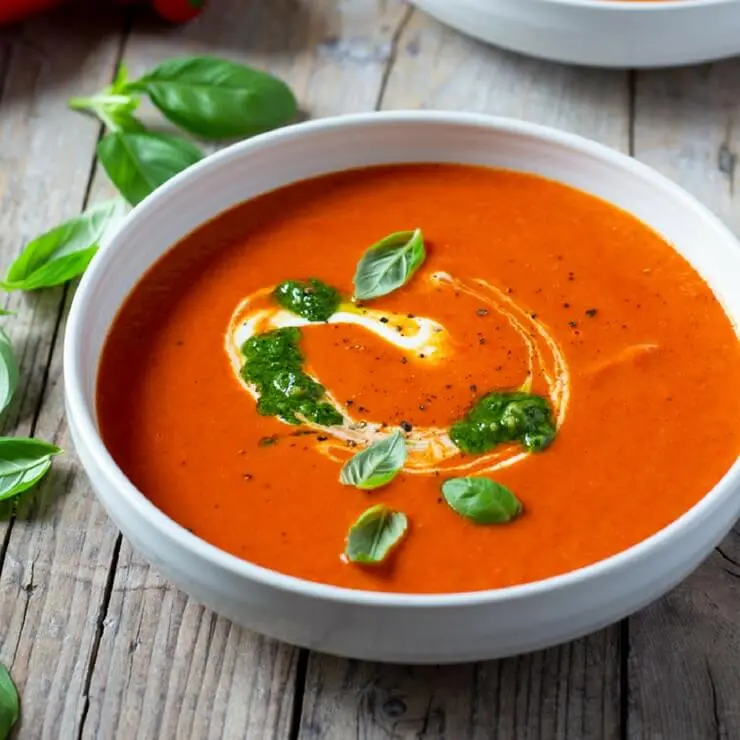 Soup with paprika, red pepper and pistachio puree