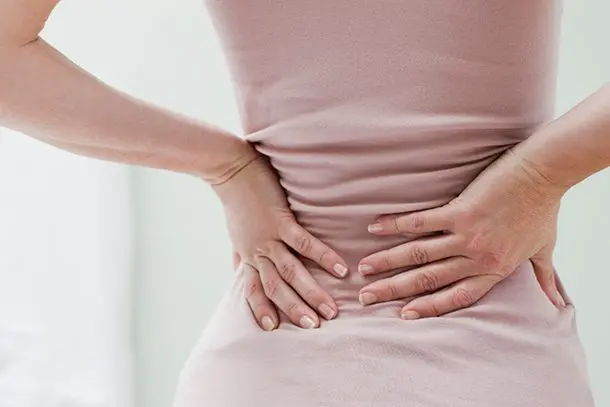 The lower back aches in early pregnancy