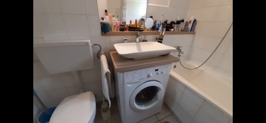 Washing machine under the water lily sink. Video