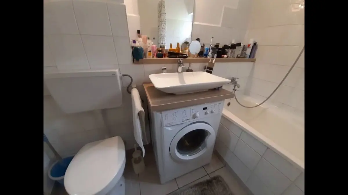 Washing machine under the water lily sink. Video