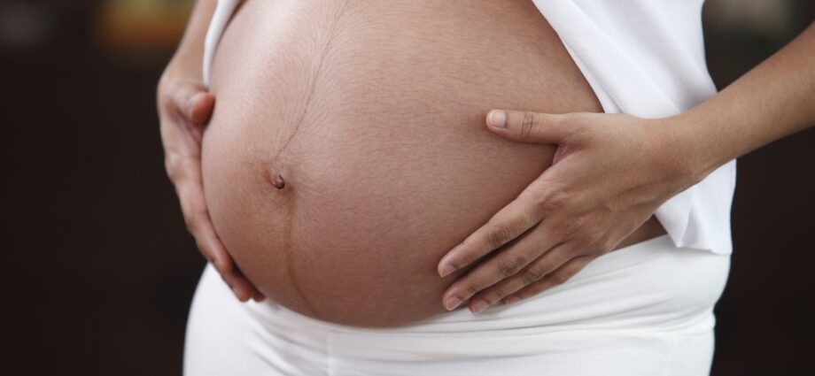 Why does the navel in pregnant women stick out and protrude?