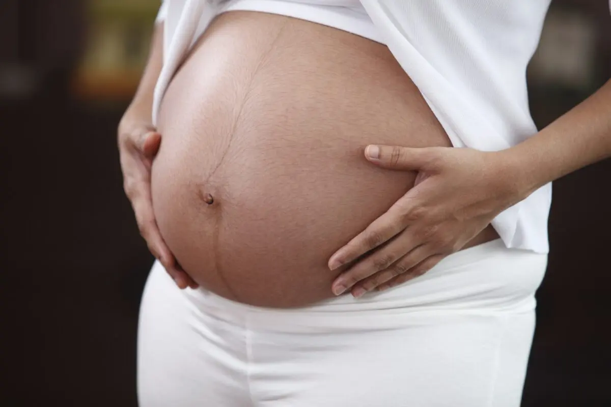 Why does the navel in pregnant women stick out and protrude?