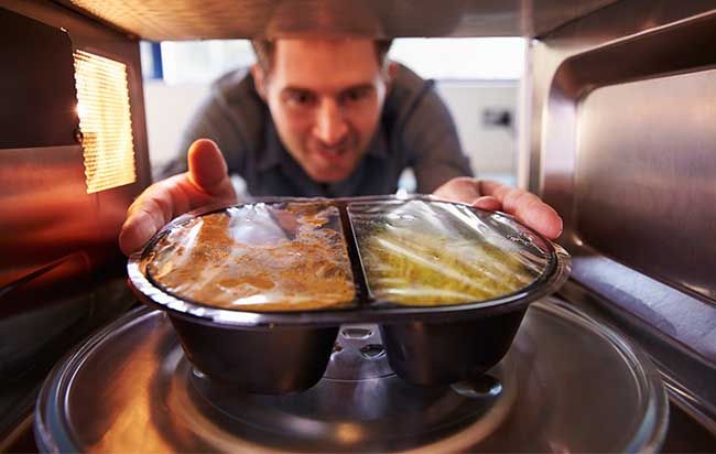 Why is it dangerous to cook food in aluminum foil