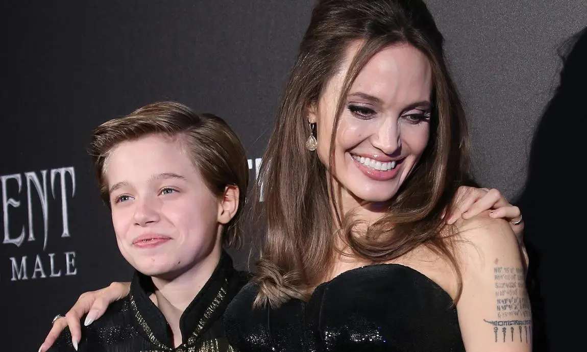 Angelina Jolie and Brad Pitt, their daughter Shiloh in 100% boyish fashion