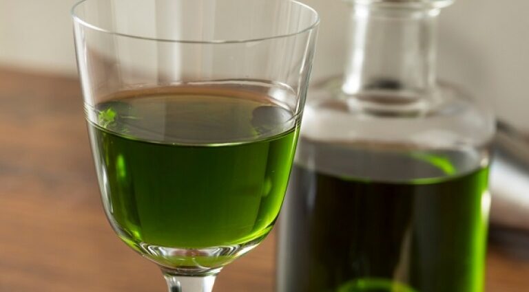 Homemade basil liqueur on vodka