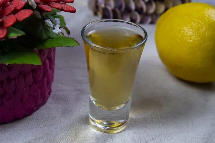 Homemade basil tincture with lemon zest