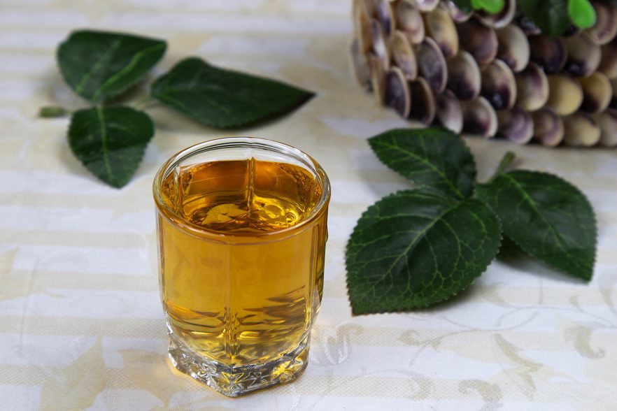 Homemade cloudberry liqueur with mint