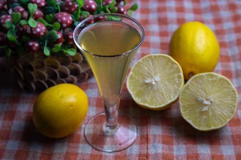 Homemade lemon liqueur based on zest and juice