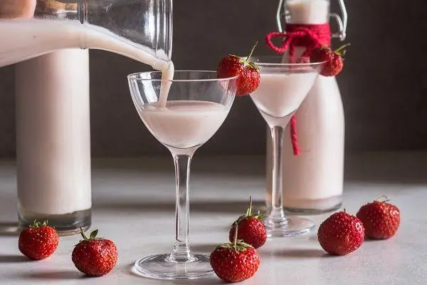 Homemade strawberry liqueur with instant condensed milk