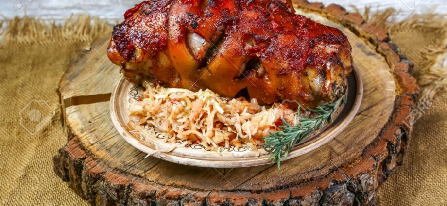 Pork knuckle baked in Bavarian beer with sauerkraut and honey