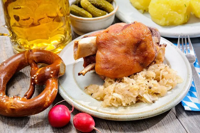 Pork knuckle baked in Bavarian beer with sauerkraut and honey