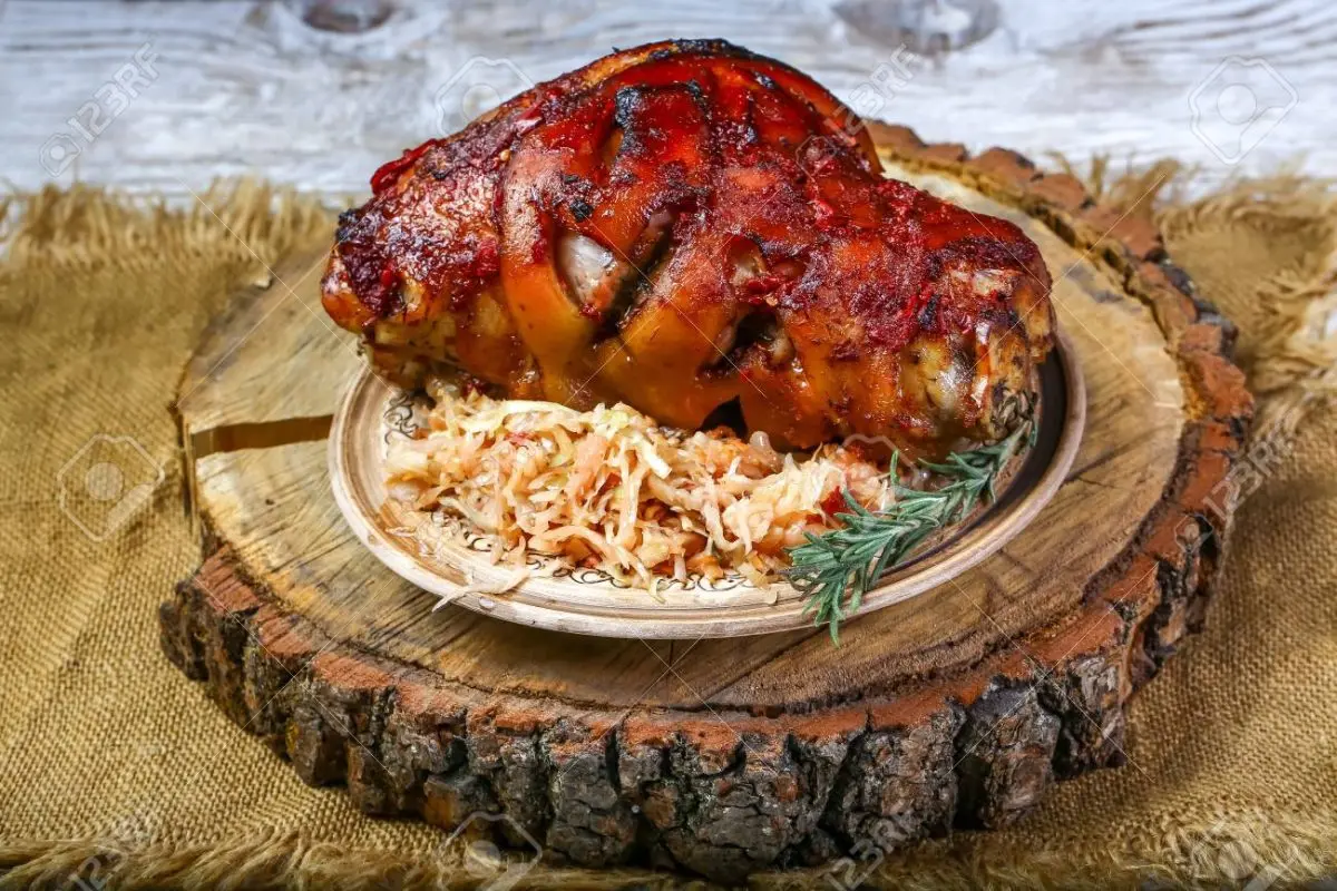 Pork knuckle baked in Bavarian beer with sauerkraut and honey