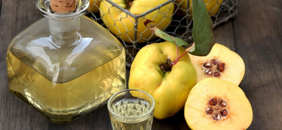 Quince pouring on vodka or alcohol