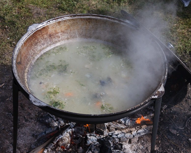 Real fisherman&#8217;s soup with vodka on a stove or fire