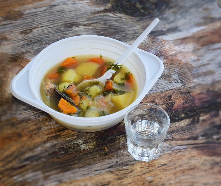 Real fisherman&#8217;s soup with vodka on a stove or fire