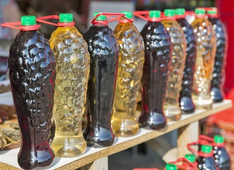 Storing homemade wine in plastic bottles and glass jars