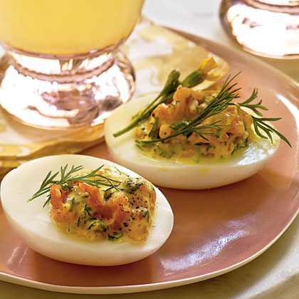 Stuffed eggs with smoked fish with herbs and mayonnaise