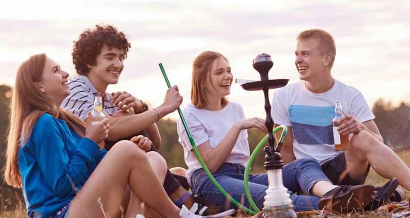 Teenager smoking a hookah