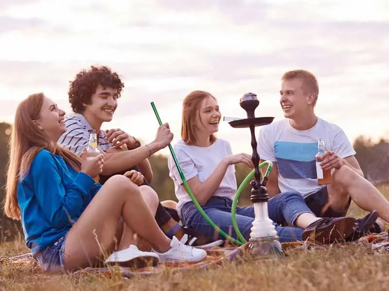 Teenager smoking a hookah