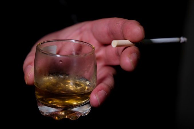 Why do people crave smoking after alcohol?